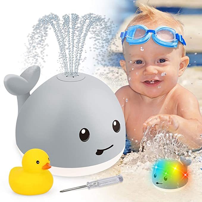 Merry & Bright Baby Cartoon Whale Floating Bath Toy – Sprays Water with Light & Music
